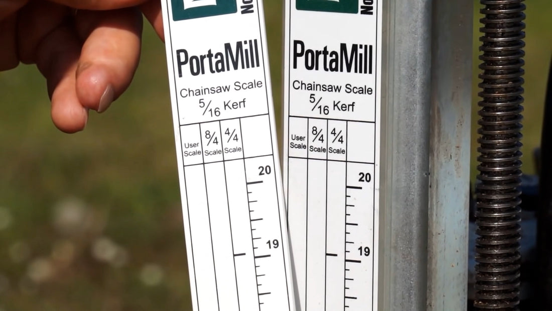PortaMill PM14 chainsaw mill lumber scales held against the sawhead carriage post.